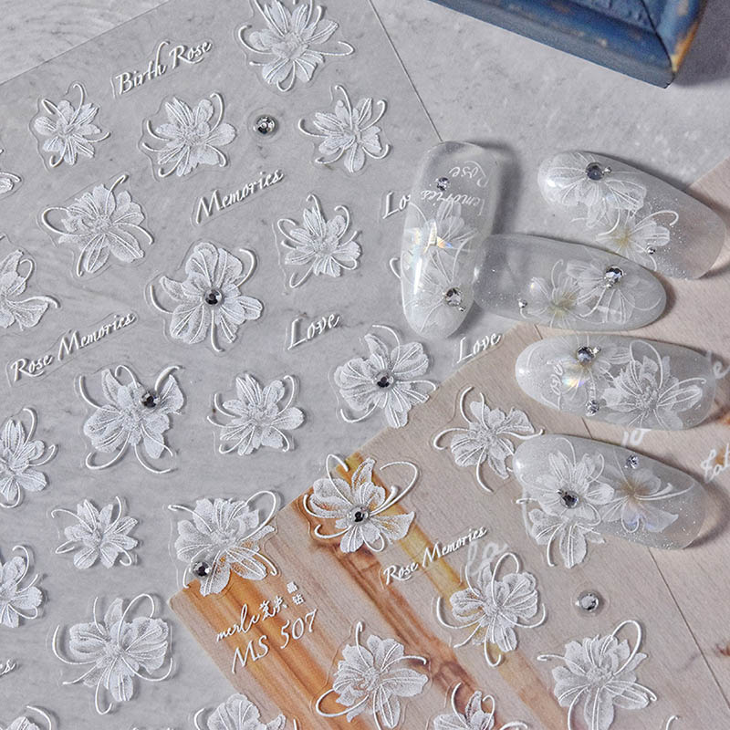 Stunning floral nail sticker in white, adorned with crystals for a touch of glamour