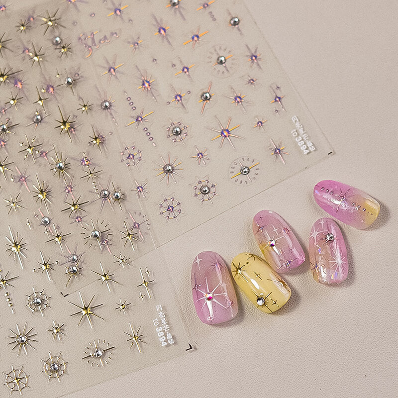 Glamorous gold nail stickers with star motifs and sparkling crystals